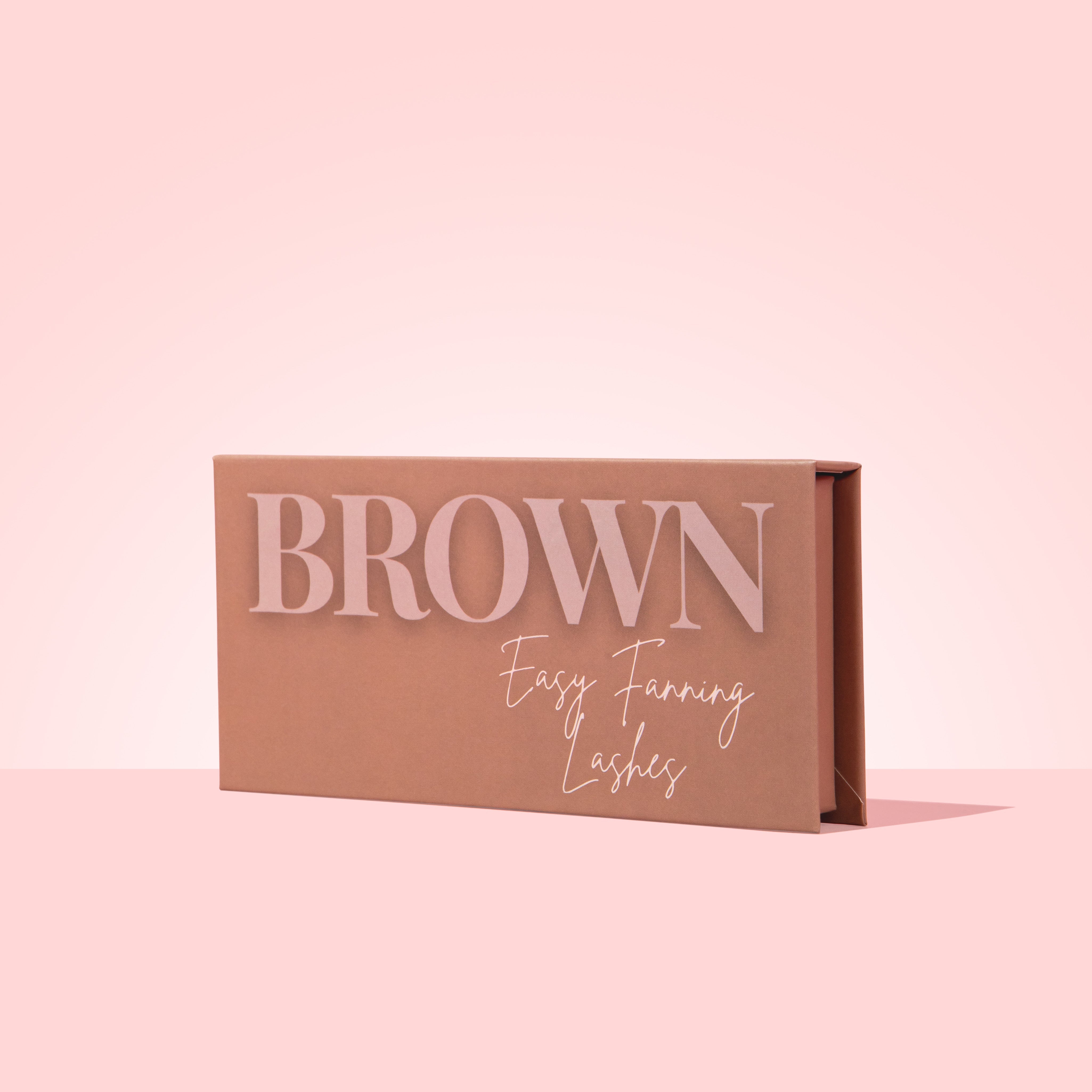 Brown lash tray on a pink background