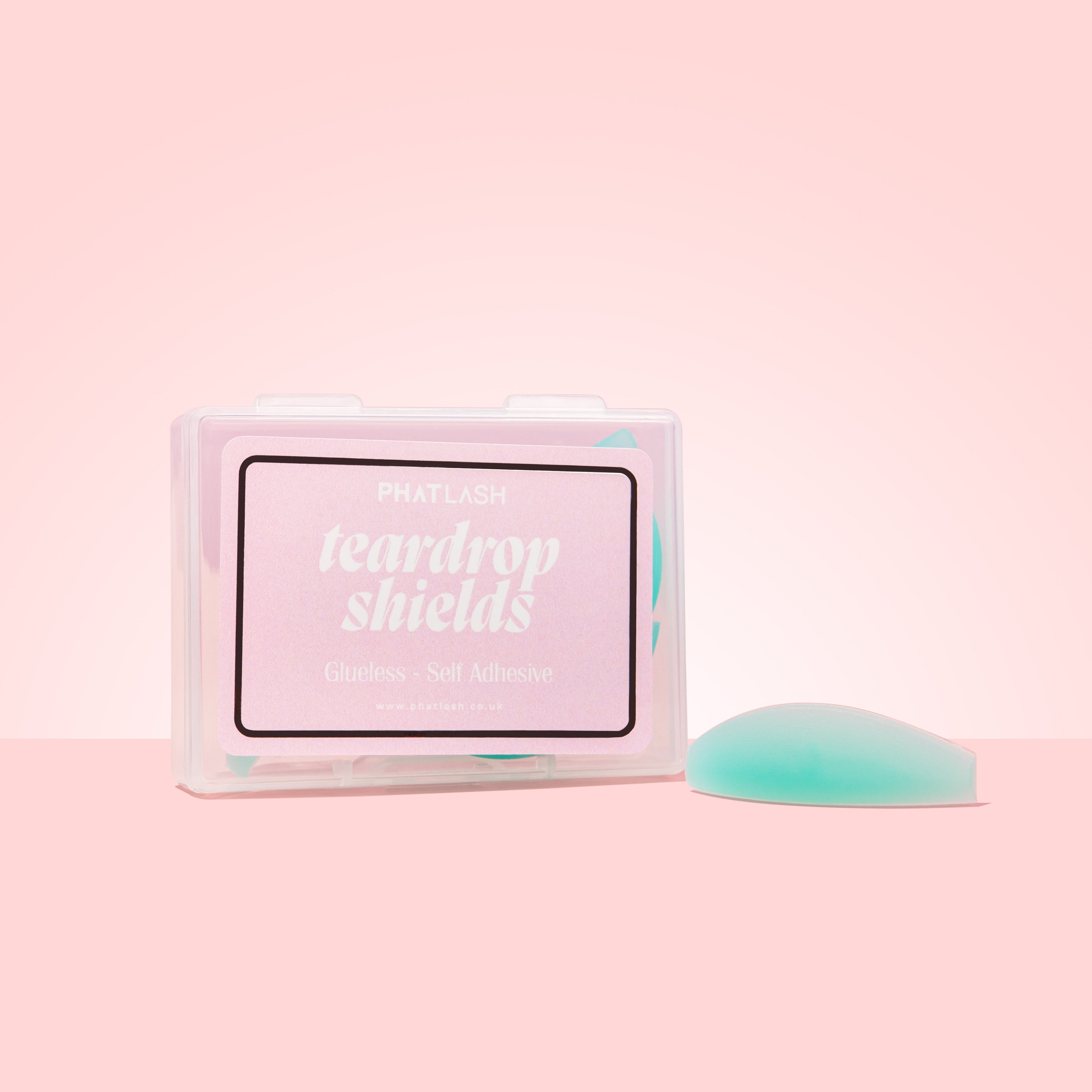 Box of 'teardrop shields' with a green shield on a pink background